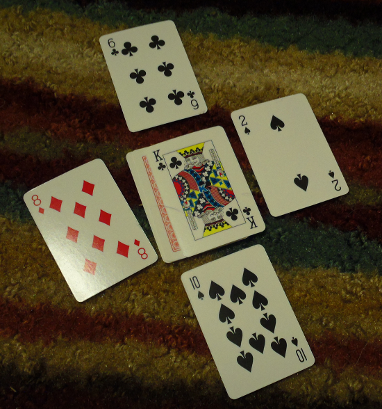 Make 10 - a face card is surrounded with bids.